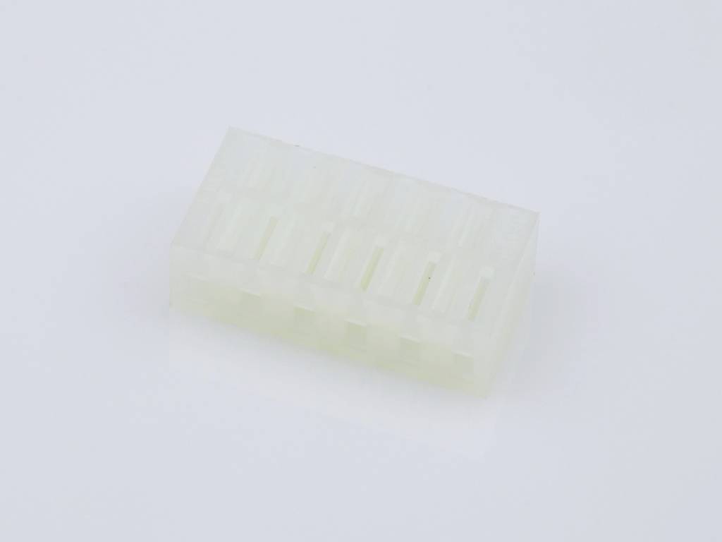 Translucent electrical plug with eight pins, rectangular form, on a white background.