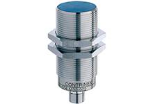 Inductive sensor in a cylindrical metal casing, suitable for industrial applications to detect metallic objects.