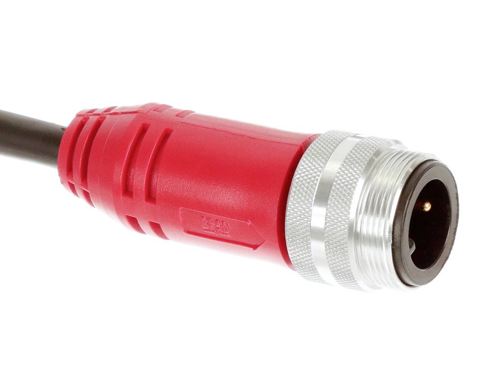 A red, cylindrical cable piece with a silver metal casing and a black connector end, possibly an electrical plug or connector.