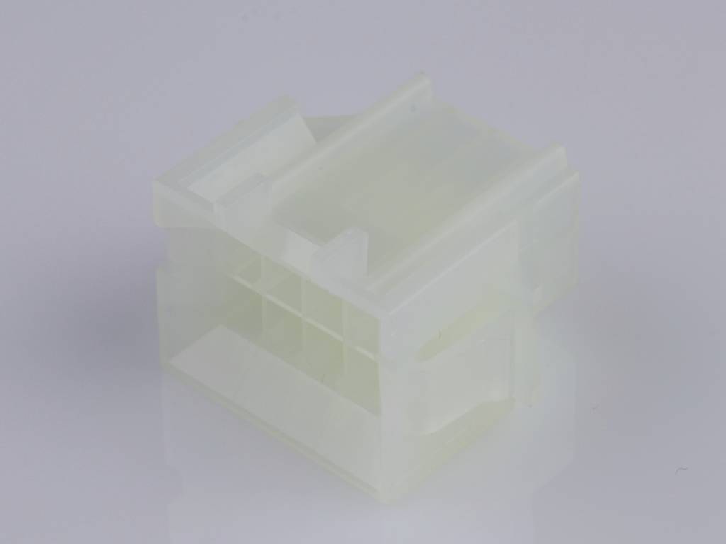 Transparent plastic plug with multiple openings, suitable for electrical connections. Resting on a reflective surface.