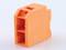 An orange plastic block with rectangular cutouts and a bevelled top edge, potentially a component.