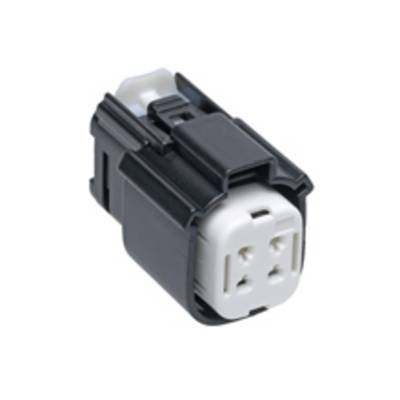 A black and white electrical plug with four holes, suitable for technical connections.