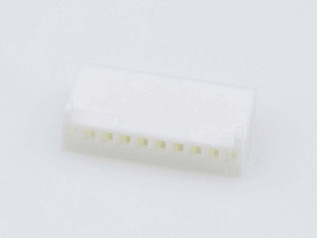 White plastic plug with multiple connection openings. Suitable for electronic connections.