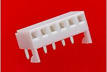 Electrical plug connector with five terminals against a red background.