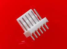 A white plug connector with six metal pins on a red background.