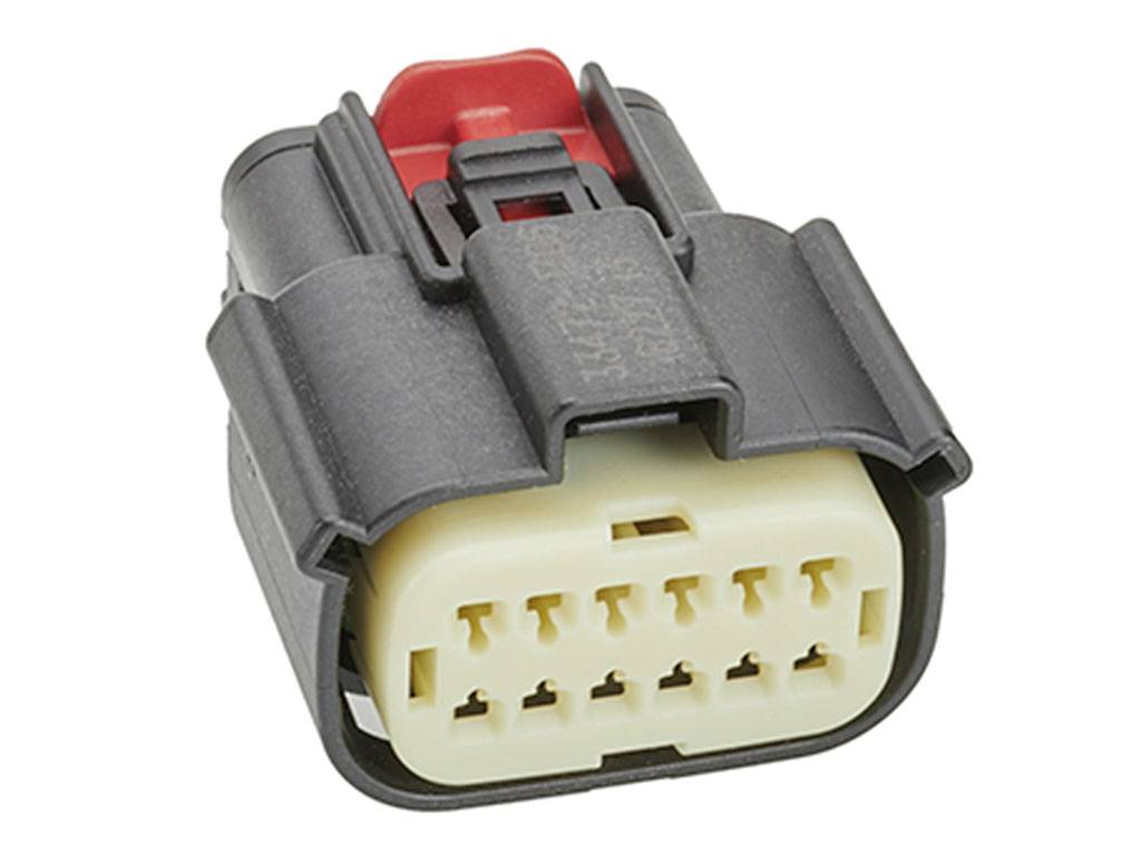 A black connector with a red clip and beige contacts, used in electronic devices for connecting cables.