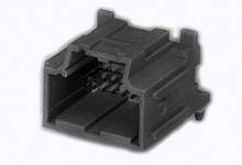 A black plastic plug with a rectangular shape and multiple internal contact openings, against a grey background.