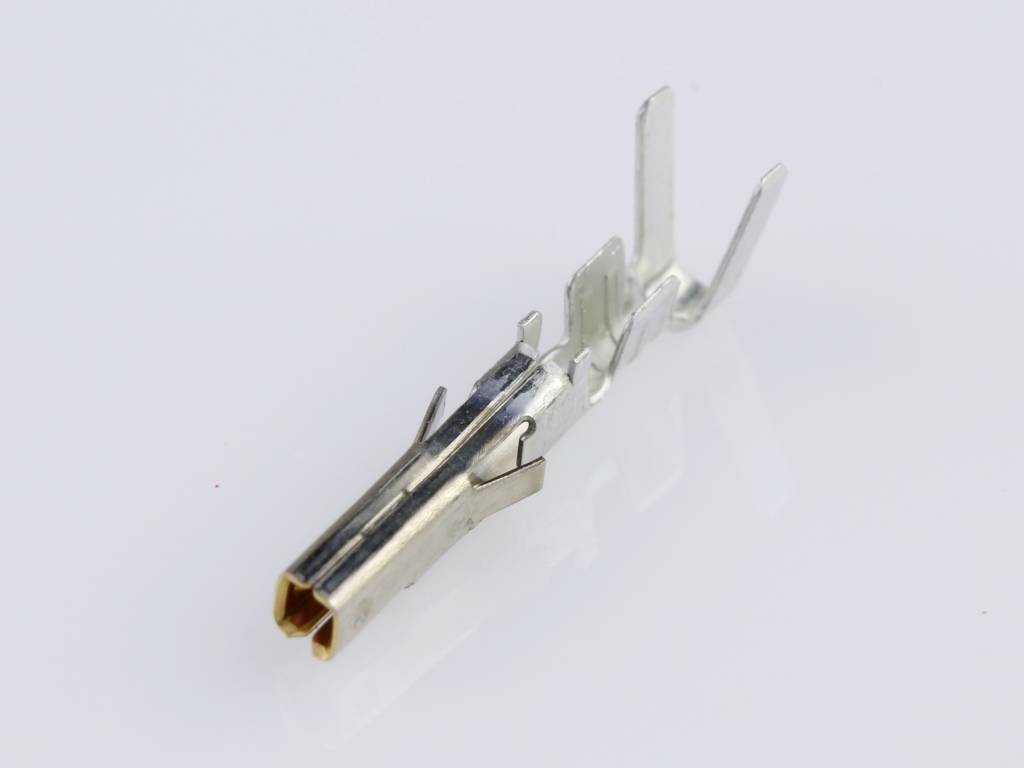 Metallic electrical connector on a white background, displaying details of pin and socket structure, for use in electrical circuits.