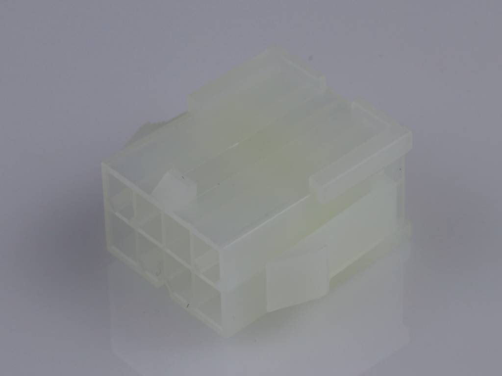 A white plastic plug with multiple connections, rectangular in shape, on a grey background.