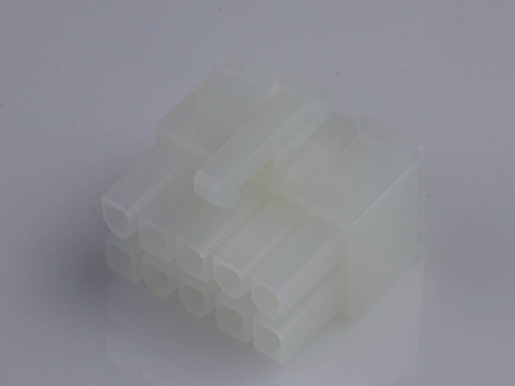 A white, opaque 8-pin plug for electronic devices lies on a reflective surface.