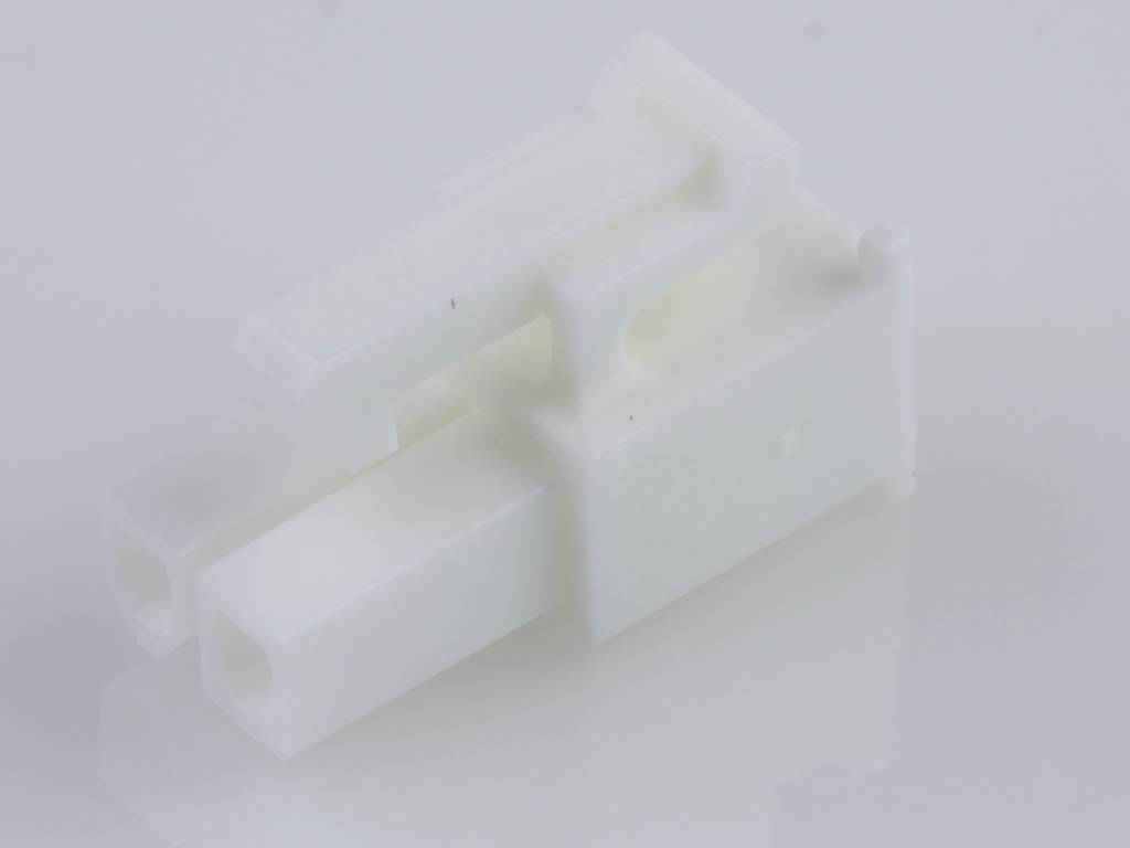 White, rectangular plastic electrical connector on a light background. It has two parallel openings for electrical cables.