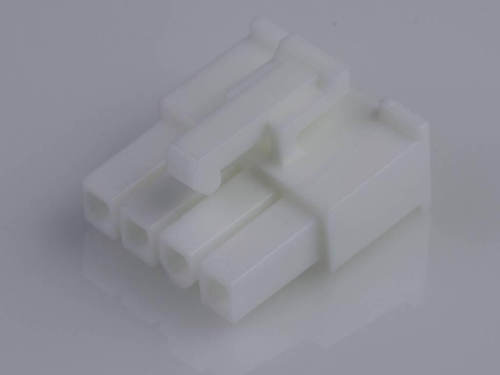 A white 3-pin electrical plug with rectangular pins, lying on a neutral surface.