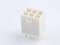 A white, rectangular plastic plug with five square openings and metal pins underneath, on a white background.