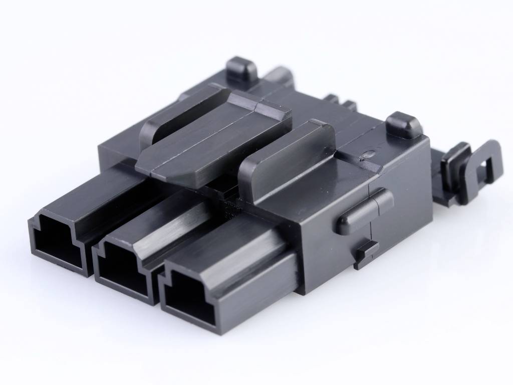 Black, rectangular plastic plug with three open slots and side mounting clips on a white background.