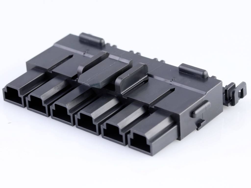 Black connector with six rectangular sockets, horizontally arranged. It is used for electrical connections.