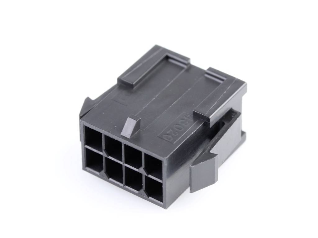 Black plastic plug with six square sockets, potentially for electronic connections.