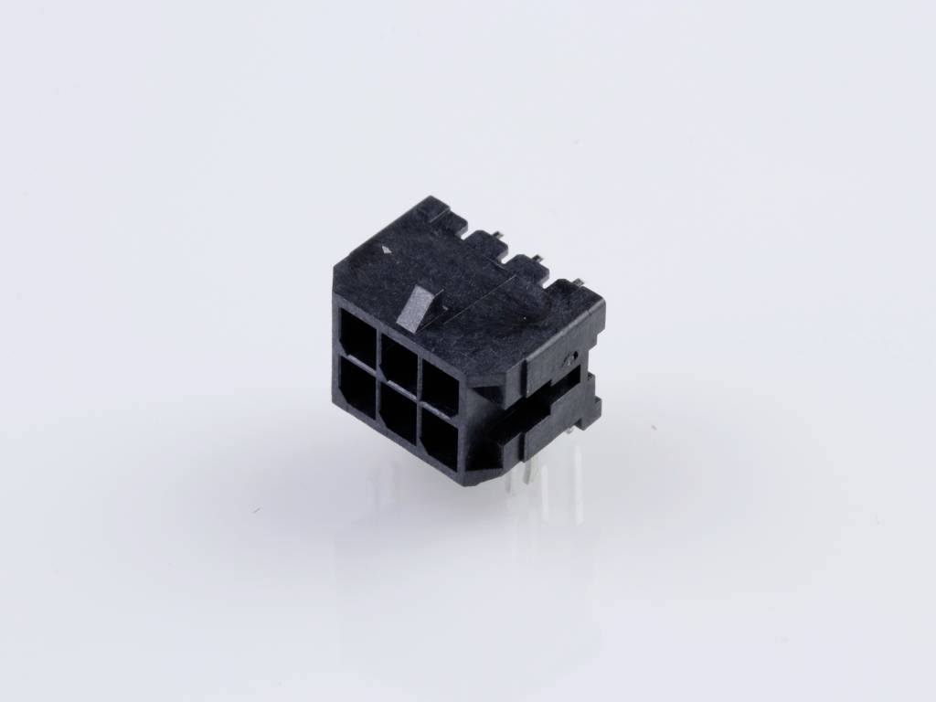 A black plastic plug with multiple square openings and four metal pins on the back, set against a white background.