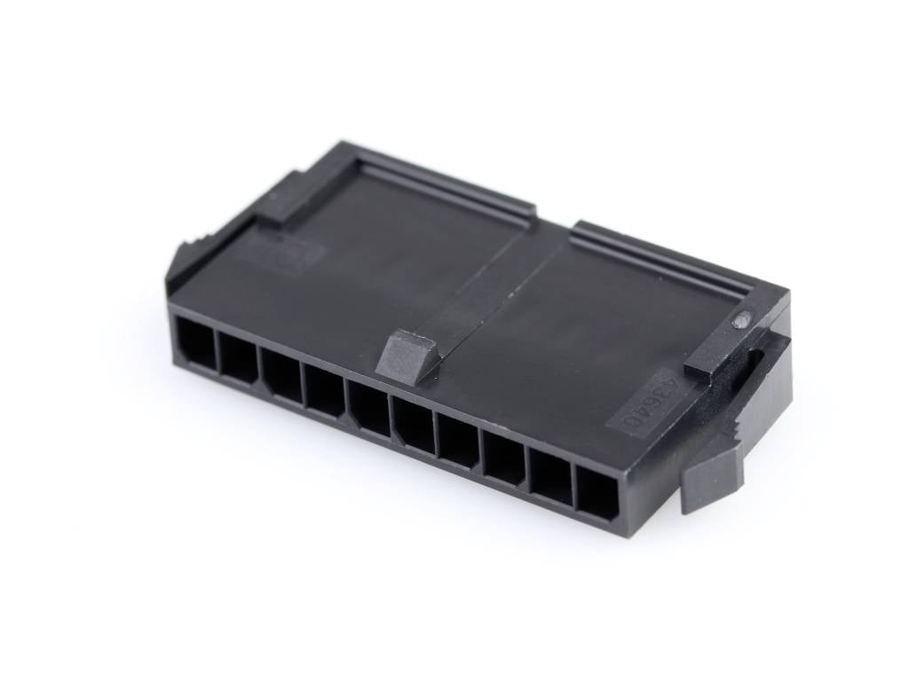 Black plastic plug with eight rectangular connection openings, commonly used for electrical connections in computers.