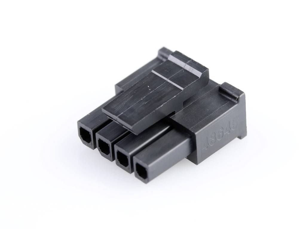 A black plastic plug with four rectangular openings, typically used for connecting electrical components.