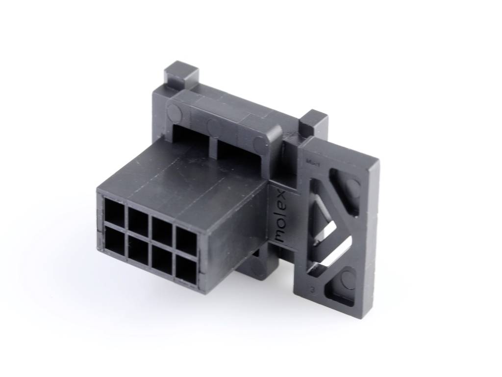 A black plastic plug with multiple connections and a side mounting bracket, used for electrical connections.