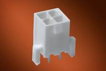 A white plastic plug with four square connectors against an orange background.