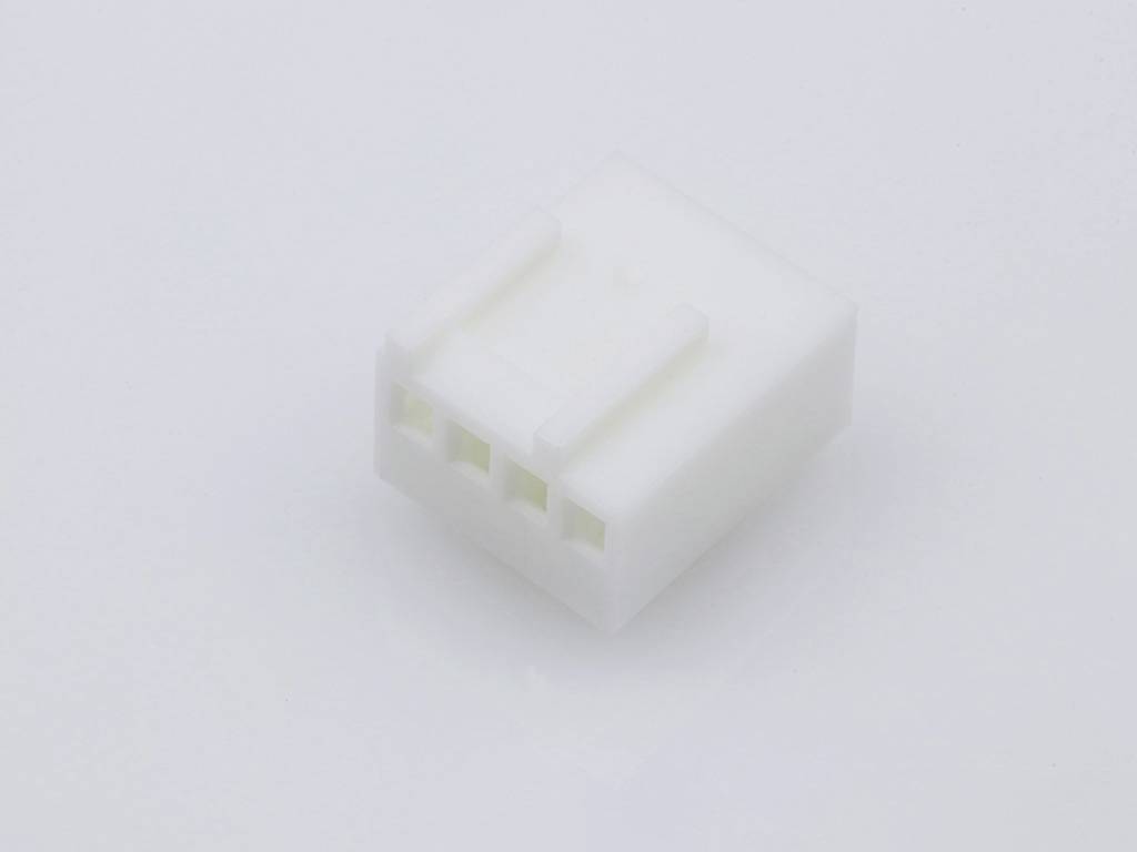 A white plastic plug with four rectangular holes, suitable for connecting electronic devices or wires.