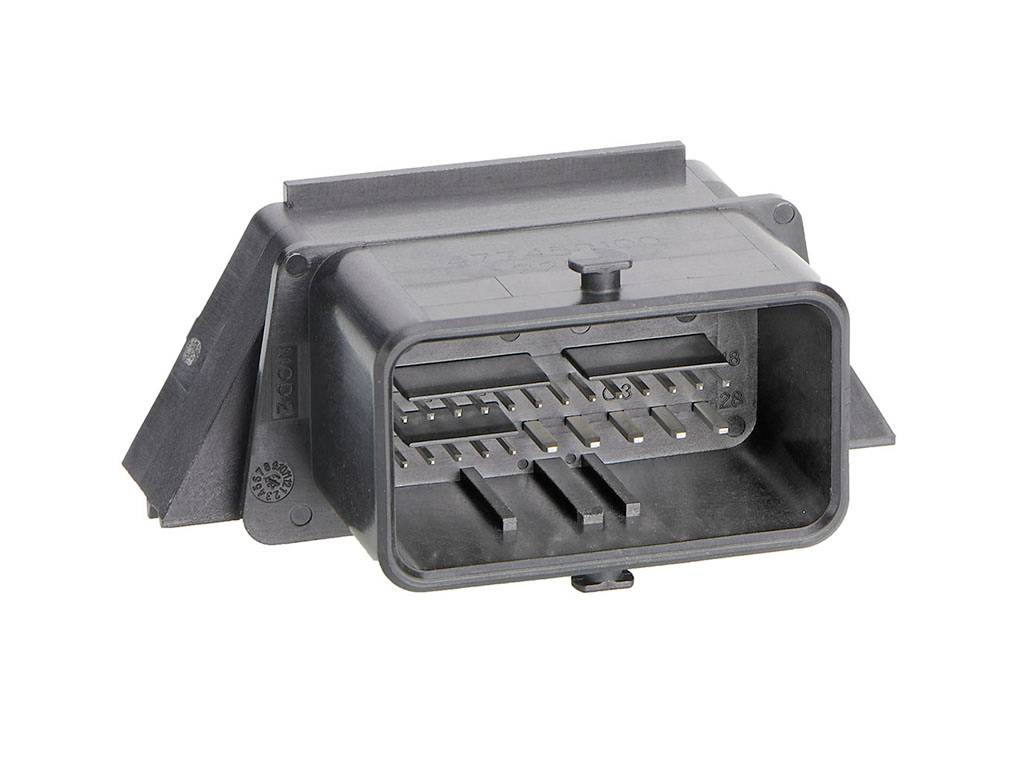 Black rectangular electrical socket with multiple metal pins. Used for connecting electrical components.