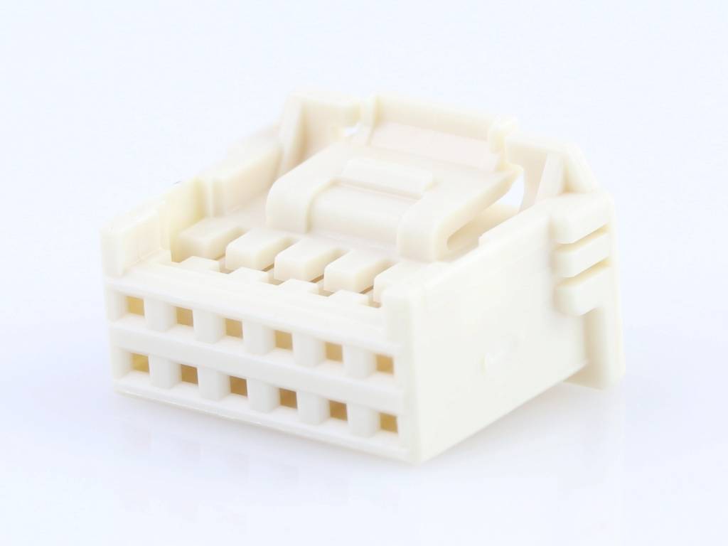A cream-coloured, rectangular plastic plug with multiple sockets, lying on a white surface.
