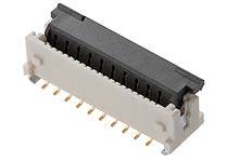 A rectangular connector with multiple golden pins on its underside, used for electronic connections.