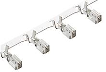 Four silver ceiling spotlights are mounted on a track and each is adjustable.