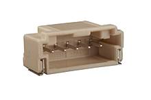 A beige, rectangular electrical plug with multiple metal pins.