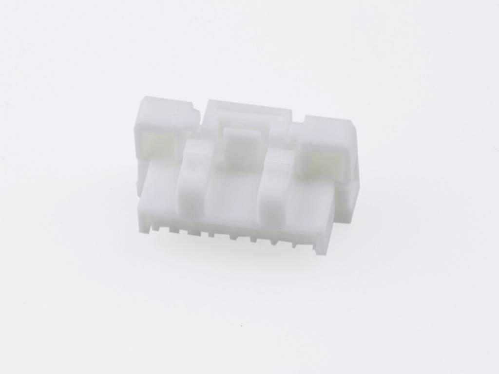 A white plastic plug with multiple pins, against a neutral background.