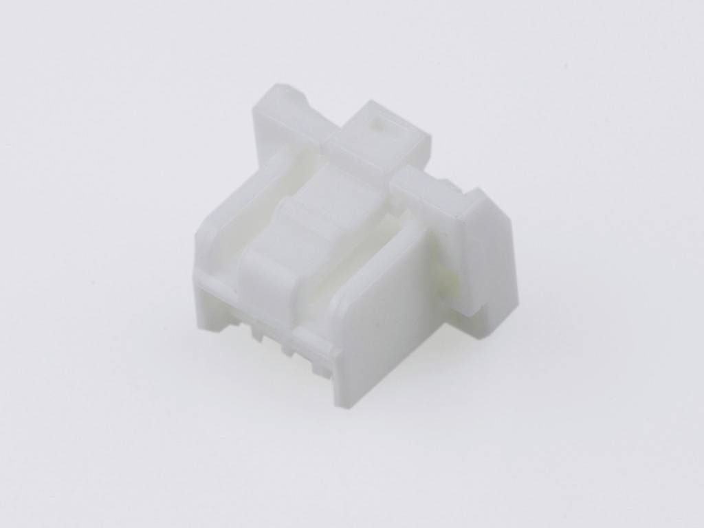 A small, white plastic component with a rectangular shape and multiple recesses, potentially a technical connecting element.