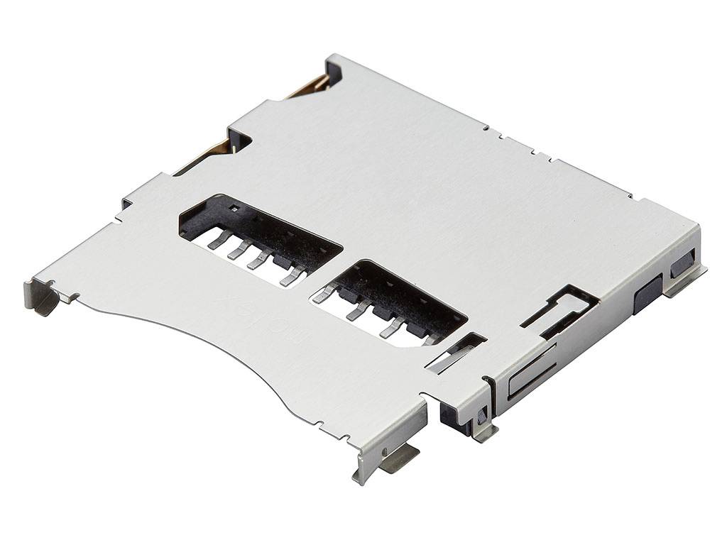A silver metal SD card slot with memory card contacts visible.