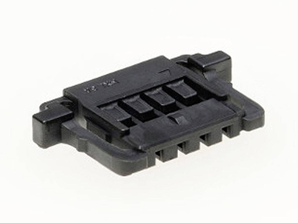 A black plastic component with multiple rectangular cutouts; possibly an electrical connector or mounting bracket.