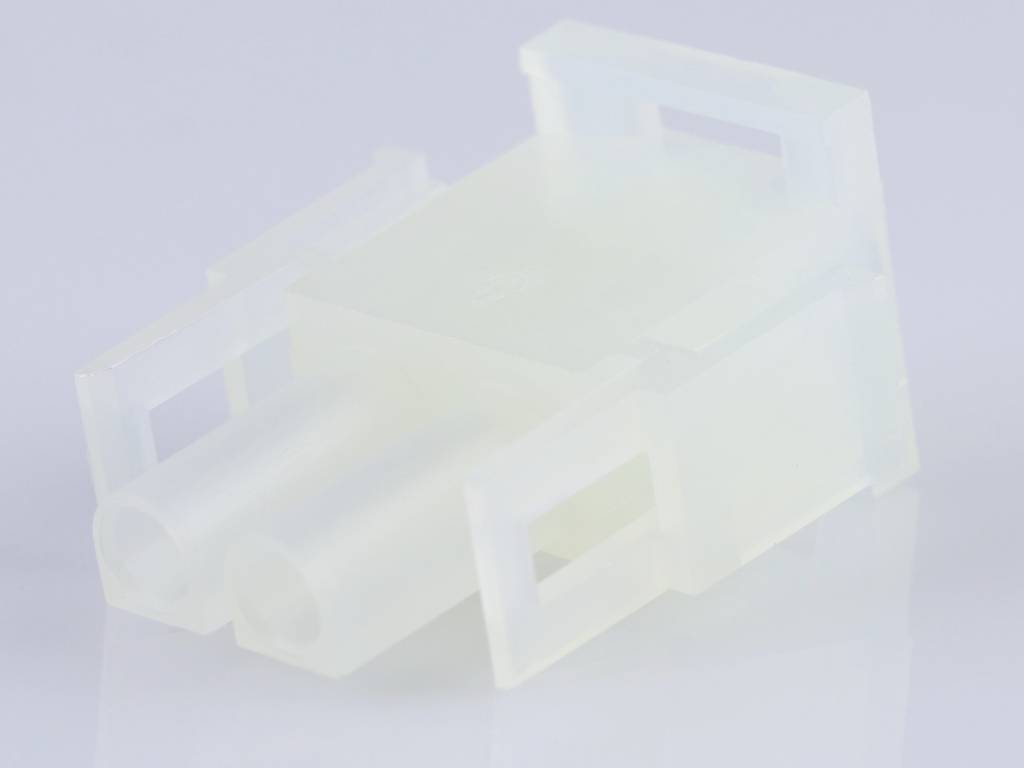 A transparent plastic plug with two connections, suitable for electrical connections, lies on a white surface.