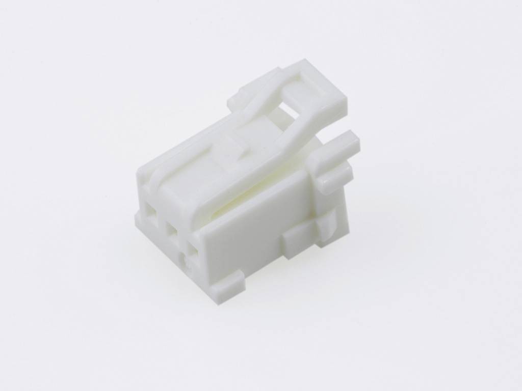 A white, rectangular plastic component with multiple small apertures and structural details, against a neutral background.