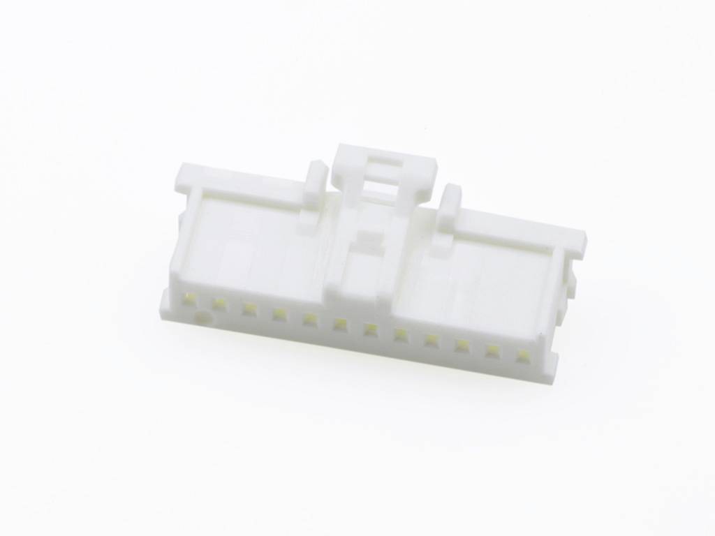 A white plastic plug with multiple connection holes, suitable for electrical connections, on a white background.