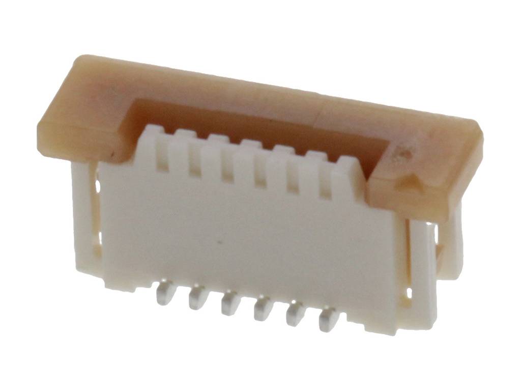 A white, rectangular electrical connector with multiple pins and a brown housing.