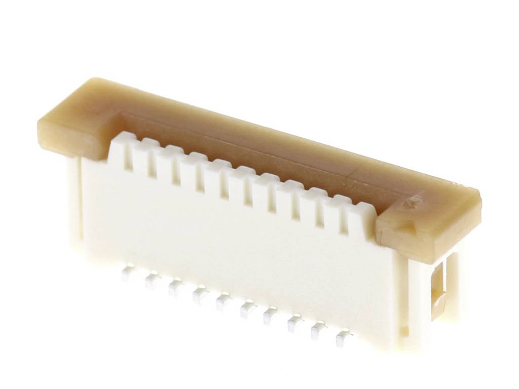 A white and brown electrical connector, typical of electronic devices, with multiple metal contacts on its underside.