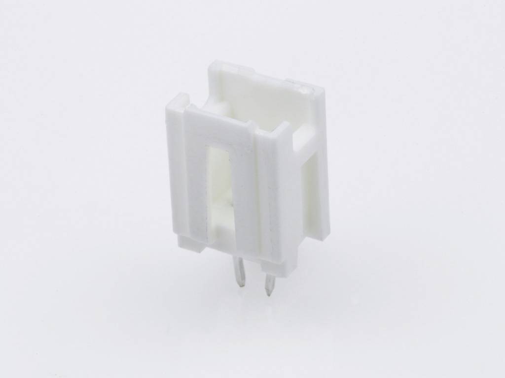 A white plastic holder for electrical engineering applications with two visible metal pins stands upright on a smooth surface.