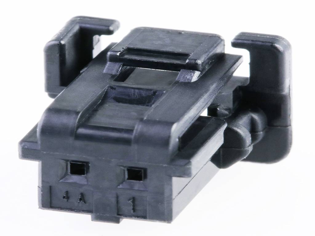 A black, rectangular plastic plug with two openings, possibly an electrical component.