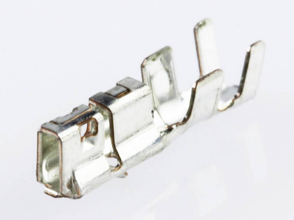 Metal contact terminal made of silver metal in close-up, on a neutral background.