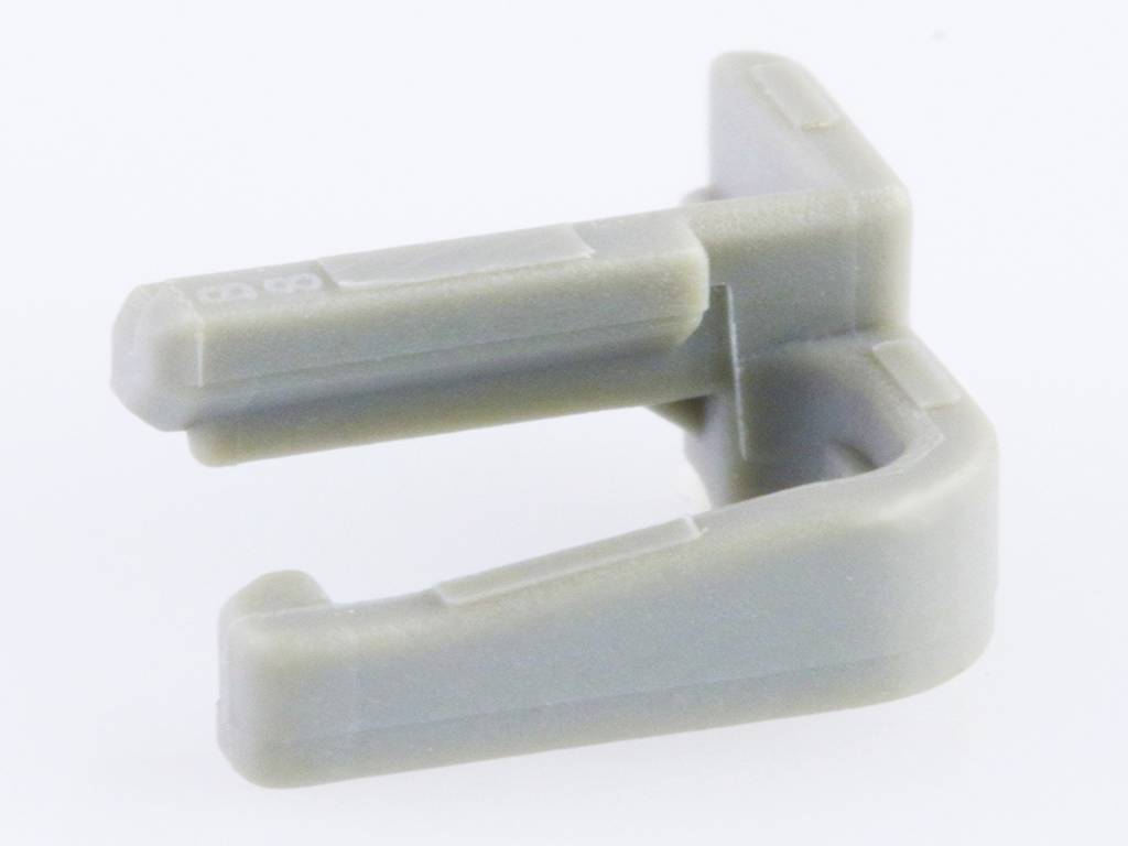 Grey plastic clip in C-shape on white background, used for cable fixing or holding objects together.