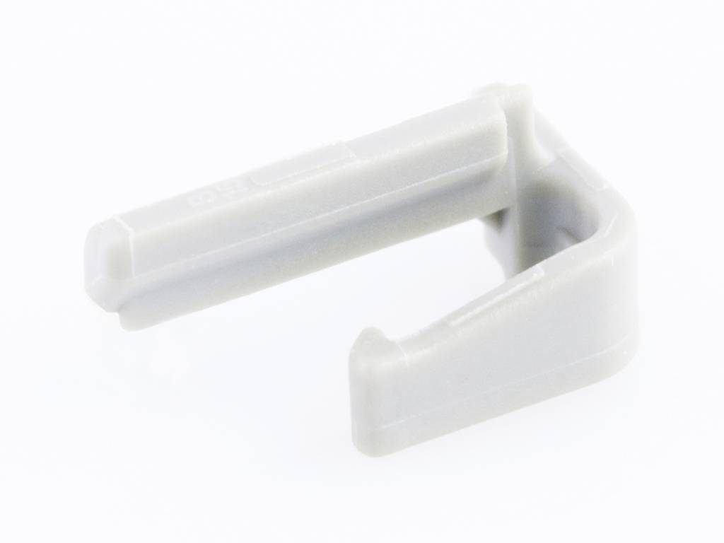 Grey plastic hook, most likely used for securing or guiding cables.