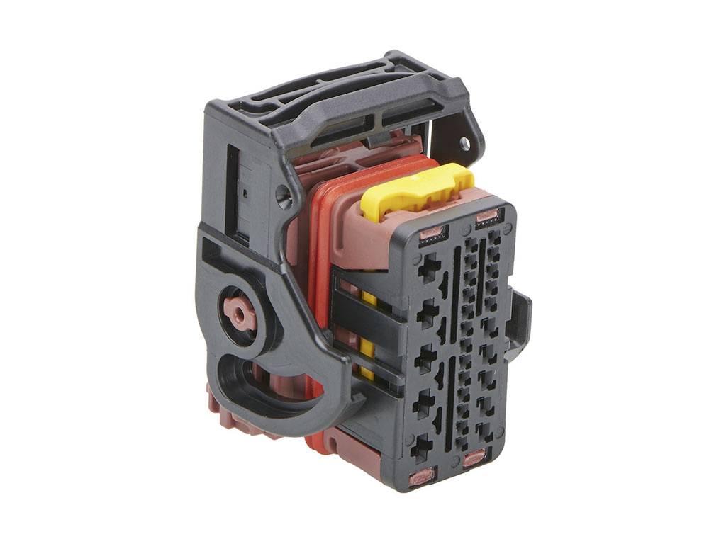 A multi-pin plug with a black housing and coloured components. Used for electronic connection in technical systems.