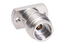 Metal connection with two screw holes on a flat base and a cylindrical opening, likely for cable connections.