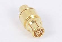 Golden coaxial connector, lying on a white background. Suitable for electronic connections and signal transmissions.