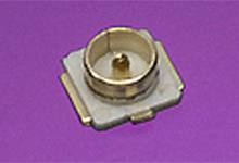 A single coaxial connector on a purple background.