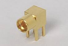 A golden electronic plug with four pins and a cylindrical aperture. Suitable for electronic connections.